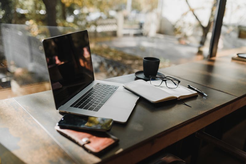 Developer working at laptop-friendly desk with natural light